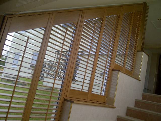 wooden shutter blinds along staircase